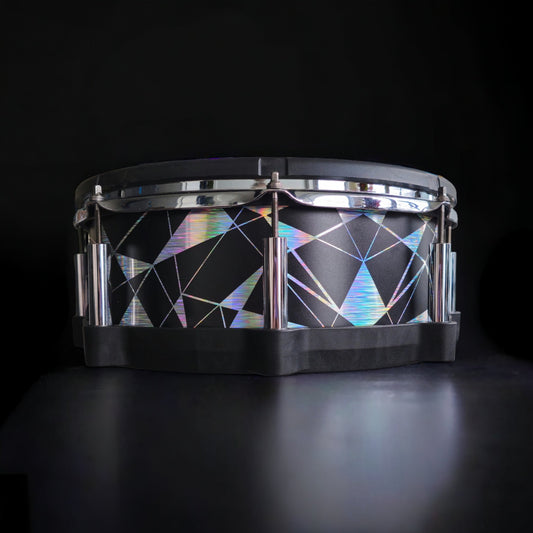 Close-up of a snare drum with a newly installed vinyl wrap, showcasing the detailed texture and professional finish, ideal for drummers seeking to upgrade their drum kit's aesthetics