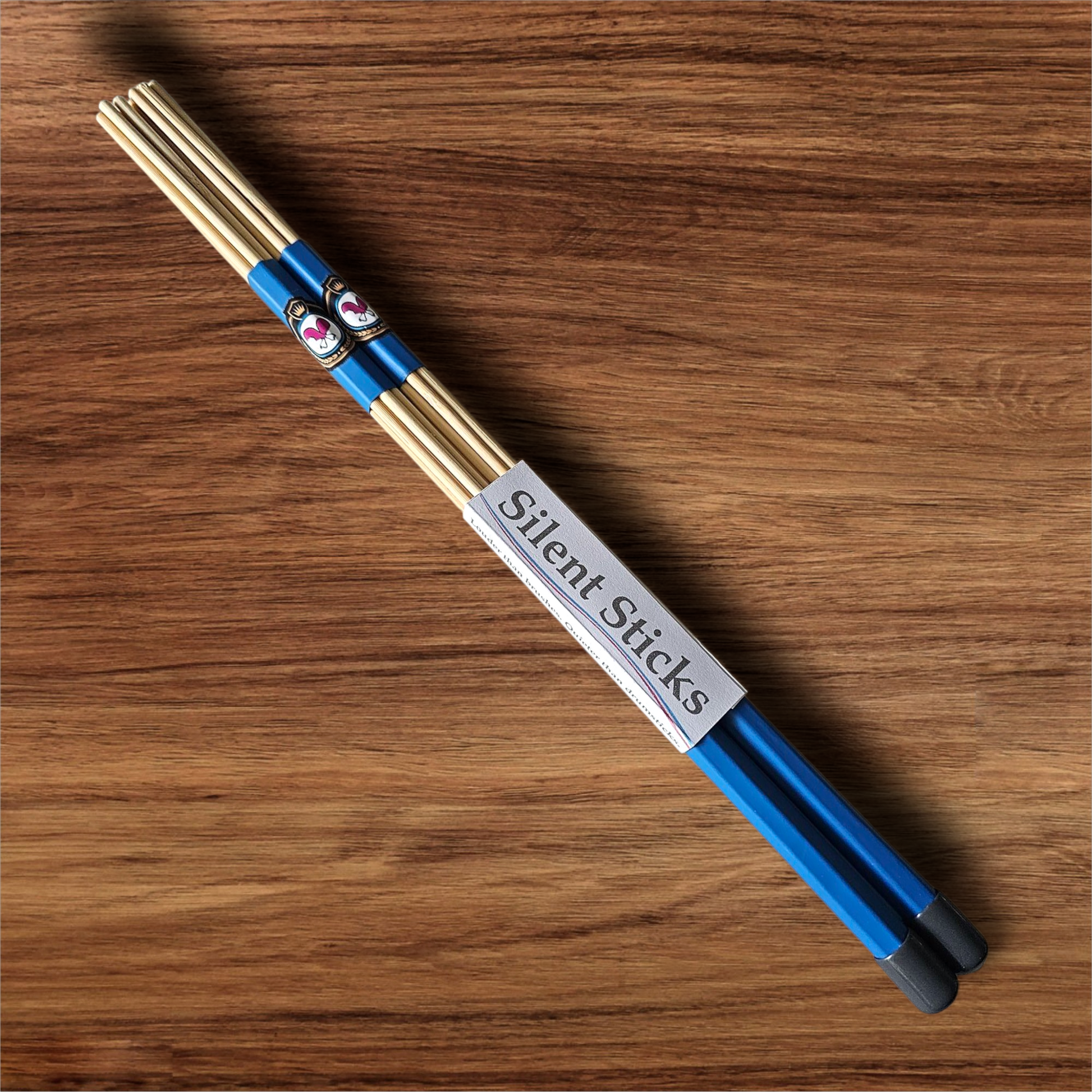 A single pair of custom Silent Sticks 7-dowel hot rod drumsticks with blue grip and grey end caps. Low volume practice drum rods for apartments and low-volume acoustic gigs.