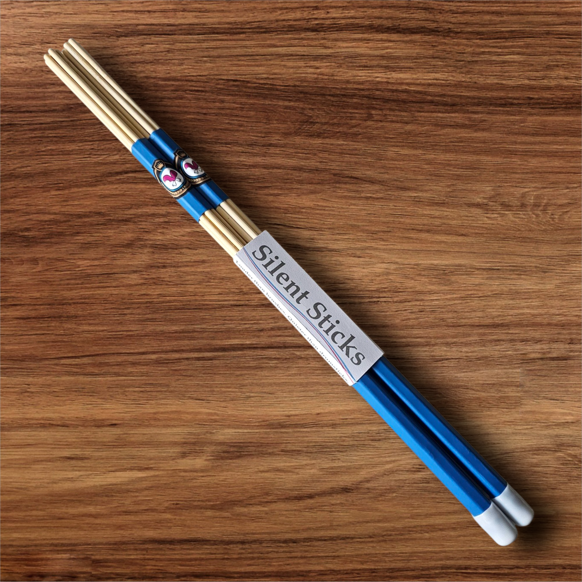 A single pair of custom Silent Sticks 7-dowel hot rod drumsticks with blue grip and white end caps. Low volume practice drum rods for apartments and low-volume acoustic gigs.
