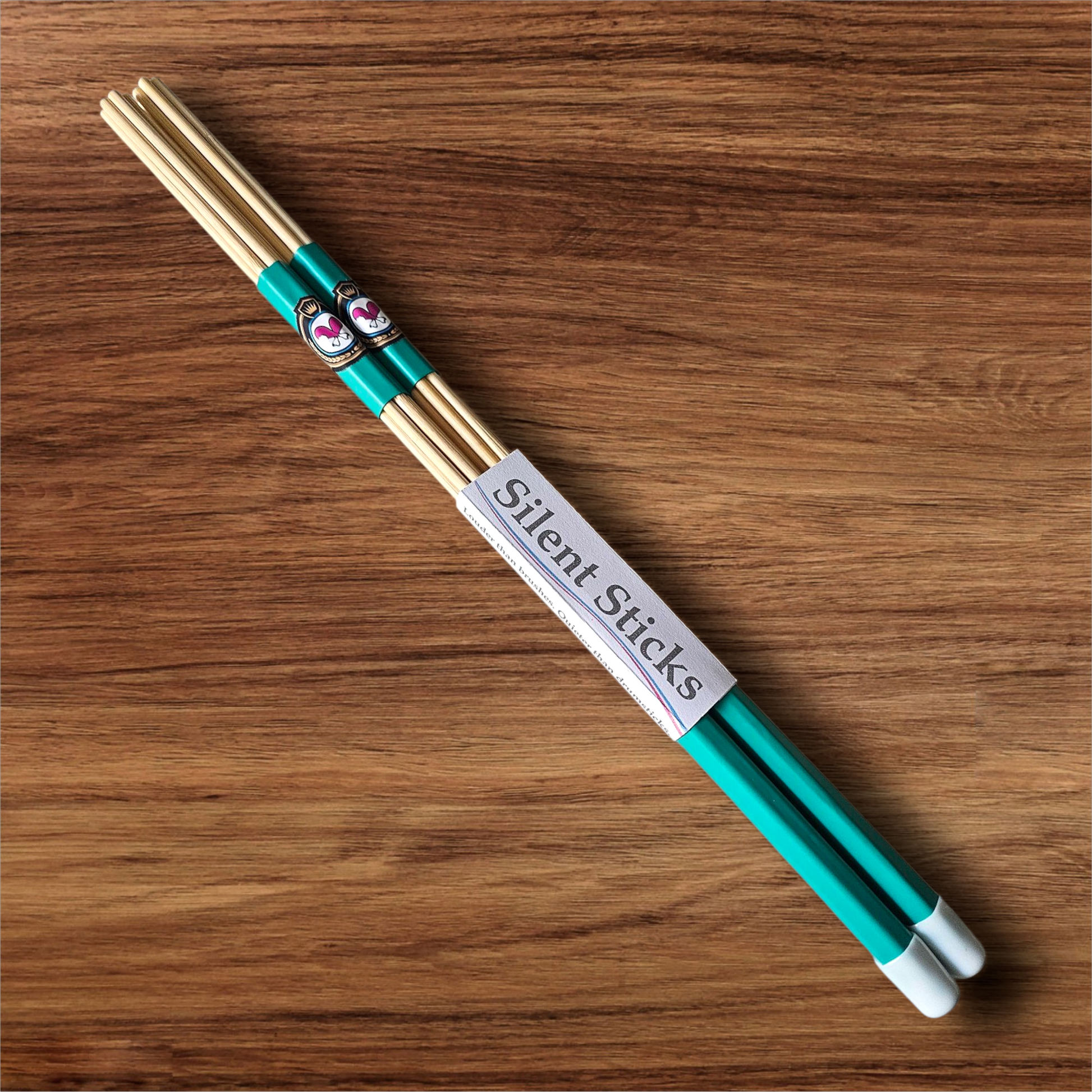 A single pair of custom Silent Sticks 7-dowel hot rod drumsticks with green grip and white end caps. Low volume practice drum rods for apartments and low-volume acoustic gigs.