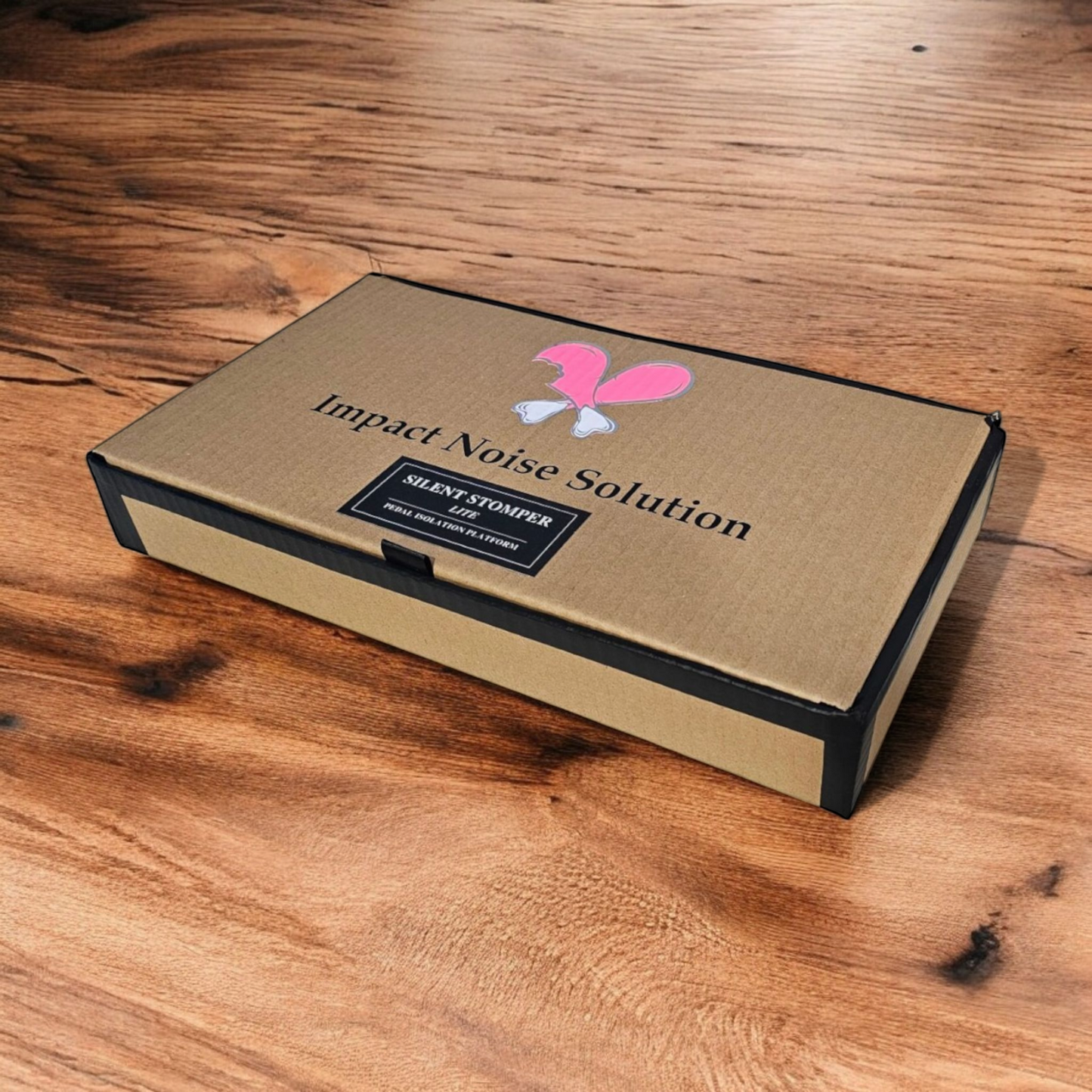 Retail box of a single pedal Silent Stomper LITE impact noise isolation platform designed for drummers, enabling quiet practice in enclosed spaces like apartment buildings by reducing vibrations and preventing noise disturbances for neighbors.
