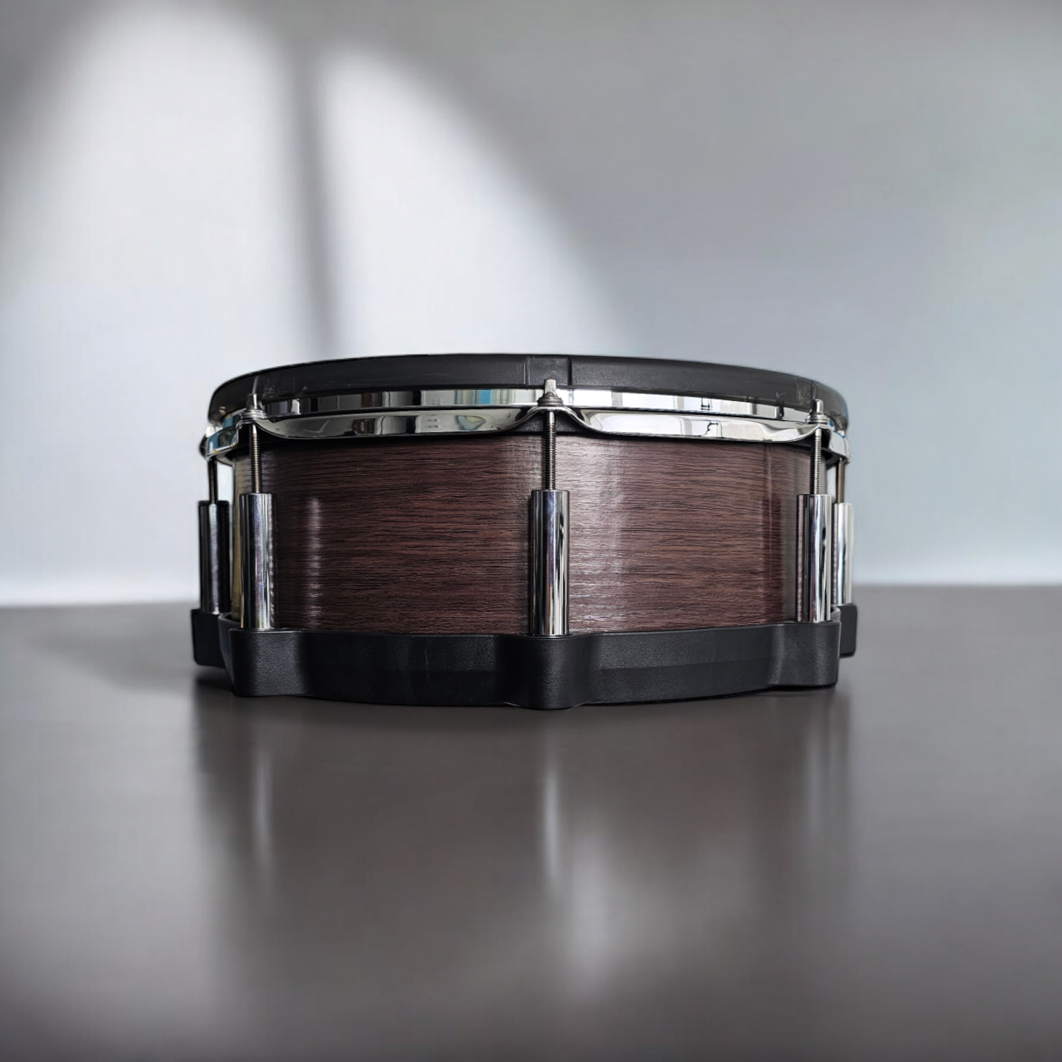 Close-up of a snare drum with a newly installed, textured walnut wood grain vinyl wrap on a Roland PD-140DS snare drum, showcasing the detailed texture and professional finish, ideal for drummers seeking to upgrade their drum kit's aesthetics.