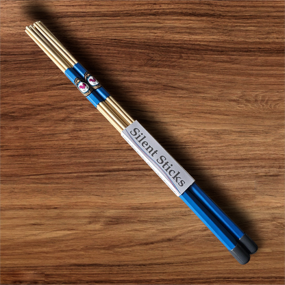 A single pair of custom Silent Sticks 7-dowel hot rod drumsticks with blue grip and grey end caps. Low volume practice drum rods for apartments and low-volume acoustic gigs.