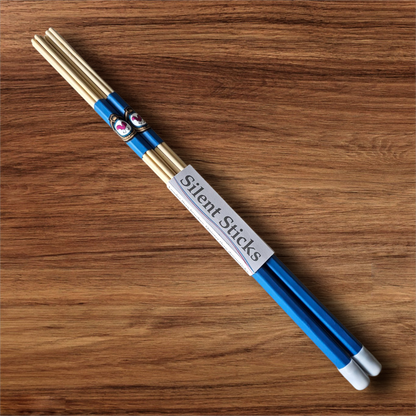 A single pair of custom Silent Sticks 7-dowel hot rod drumsticks with blue grip and white end caps. Low volume practice drum rods for apartments and low-volume acoustic gigs.