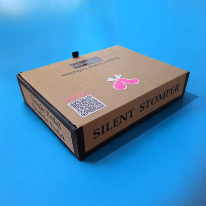 Retail box of a single plus double pedal pack of Silent Stomper impact noise isolation platforms designed for drummers, enabling quiet practice in enclosed spaces like apartment buildings by reducing vibrations and preventing noise disturbances for neighbors.